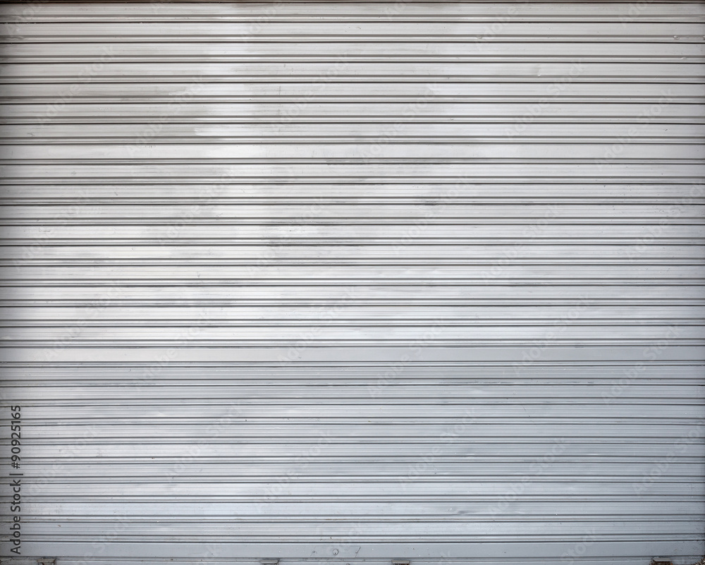Gray roller shutter metal garage gate, texture Gray roller shutter metal garage gate, texture