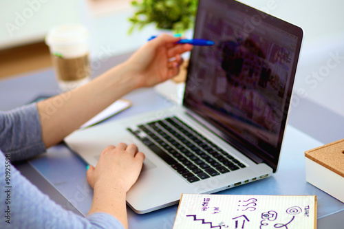 Young businesswoman working on a laptop