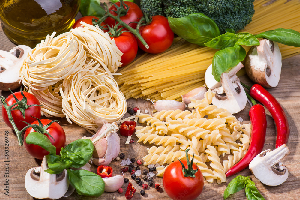 Pasta ingredients on a wood background Pasta ingredients on a wood background