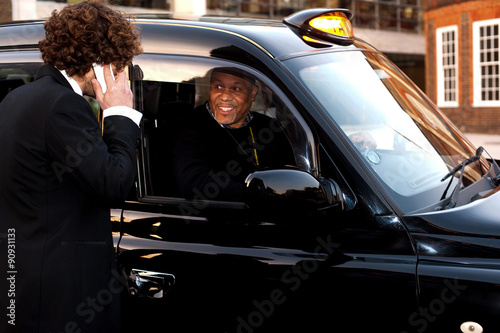 Passenger communicating with taxi driver