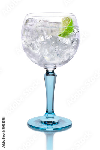 Glass with gin, tonic, lime and ice