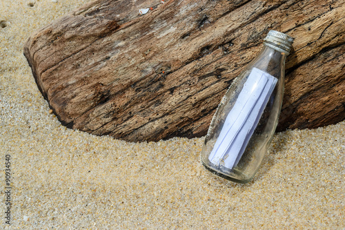 letter in a bottle on the sand beach 