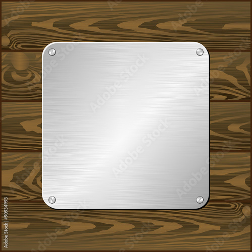 silver plaque on dark board