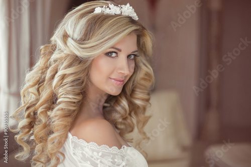 Healthy hair. Beautiful smiling girl bride with long blonde curl