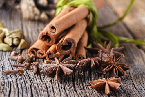 Mulled wine recipe, spices on wooden background