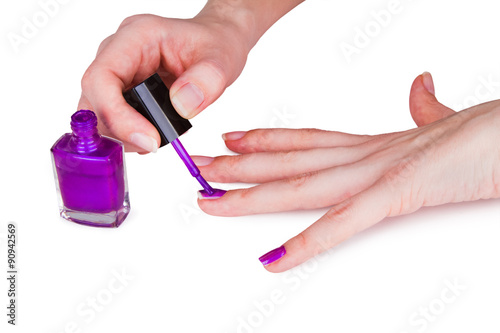 Young woman paint her nails