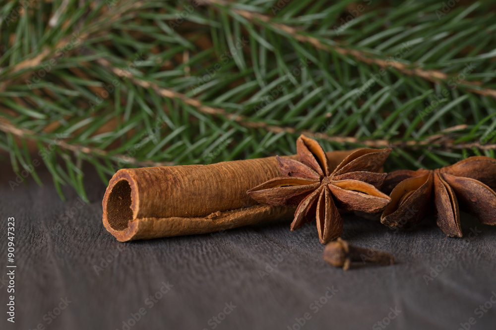 star anise and fir on background a wooden boards star anise and fir on background a wooden boards