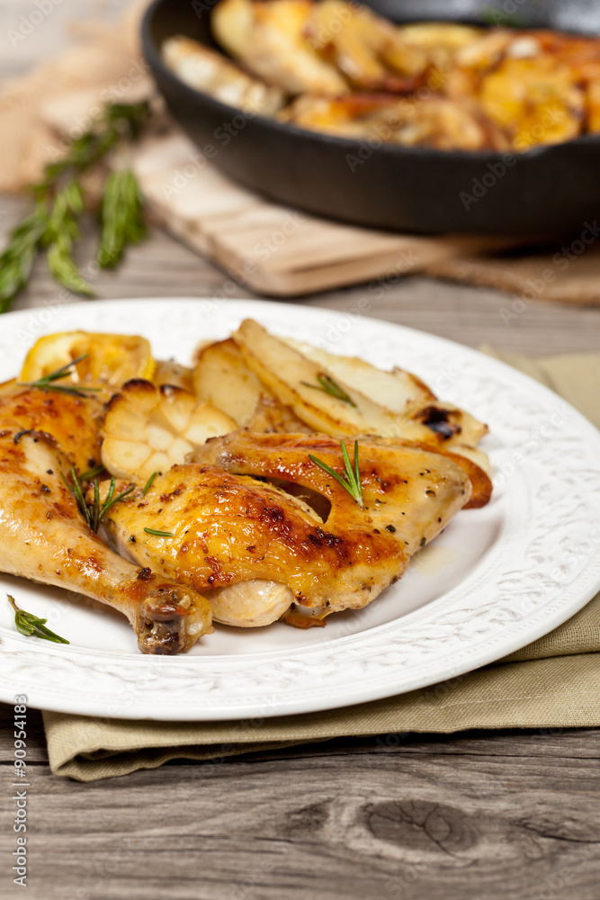 Garlic, Lemon and Rosemary Roasted Chicken. Selective focus.