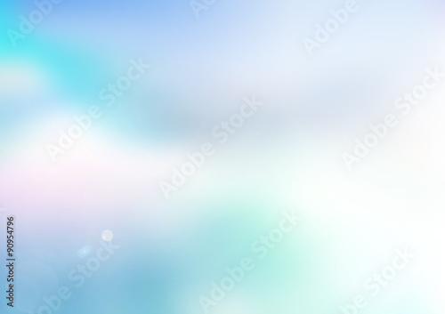 Blurred of a blue sky with sun ray background and clouds