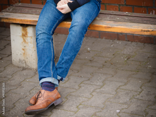 Male legs in jeans and boots