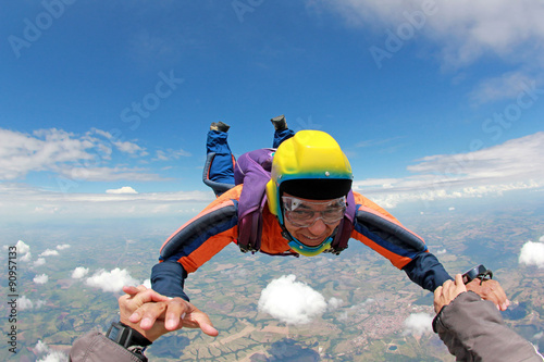 Skydiver senior man, smiling in free fall