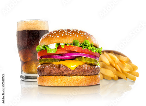 Hamburger fries and a coke soda pop cheeseburger combination deluxe fast food on white
