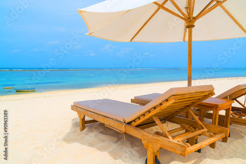 Lounge chairs on a tropical beach © twenty2photo