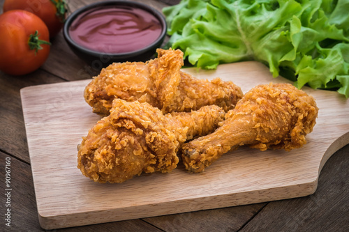 Crispy fried chicken on wooden plate and dip sauce