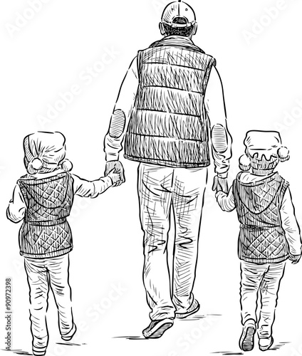 father with his daughters on a stroll