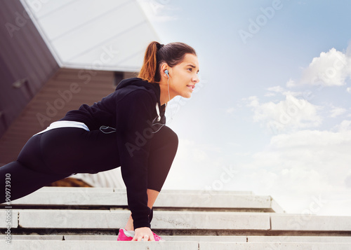 Young woman exercising in urban environment 