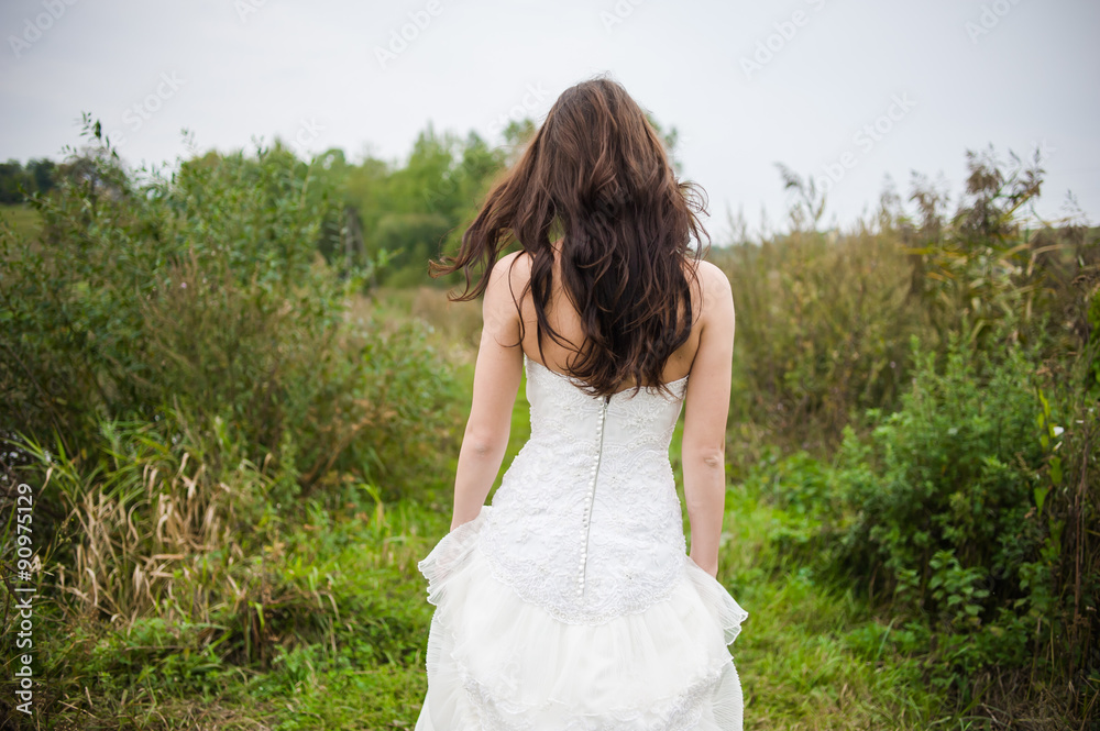Beautiful bride in wedding dress preparing to ceremony in church. Walking near old castle Beautiful bride in wedding dress preparing to ceremony in church. Walking near old castle