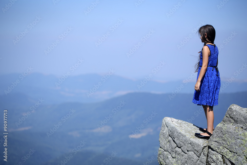 Thoughtful girl in mountains