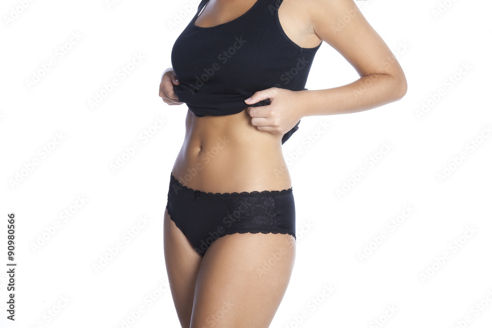 Fototapeta premium Beautiful slim body of woman in lingerie. Isolated on white background