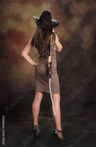 Cowboy girl. Young attractive brunette in l cowgirl, costume, halloween