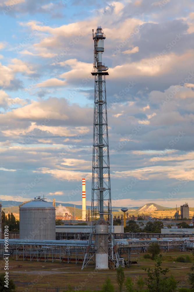 Fototapeta premium Flare stack at oil and gas refinery plant