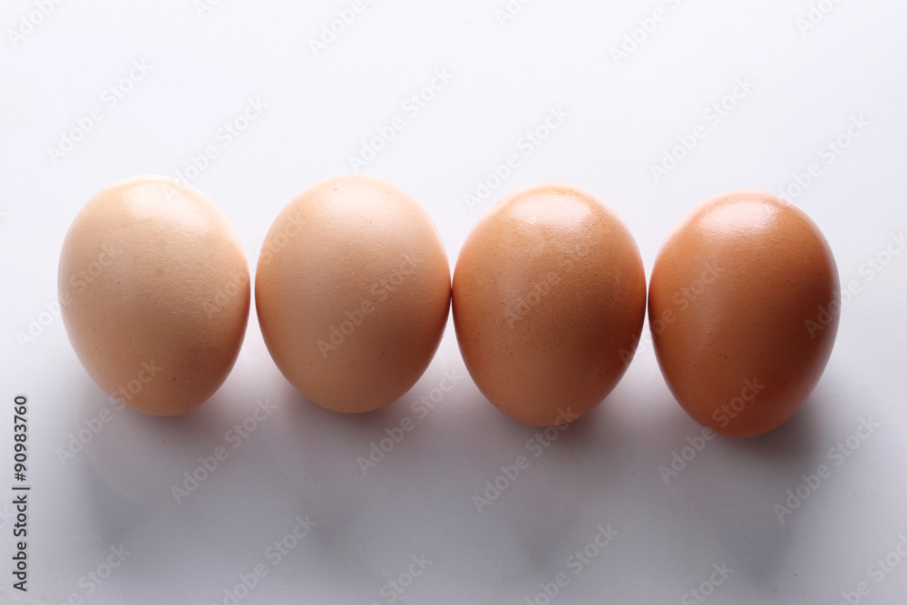 brown eggs on marble top table.