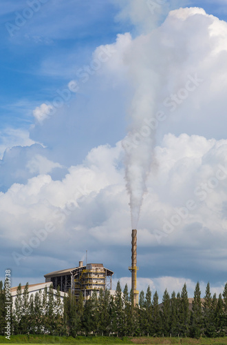 factory smokestack on blue sky background 