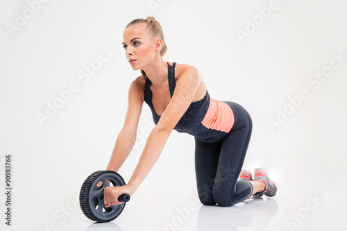 Woman workout with exercises wheel