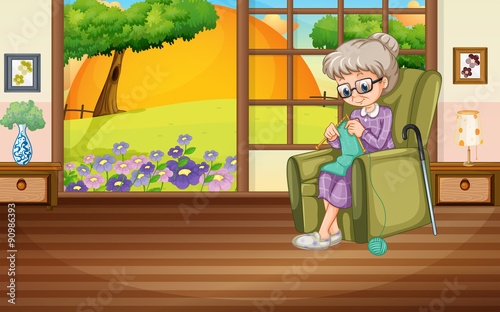 Old lady knitting on the armchair