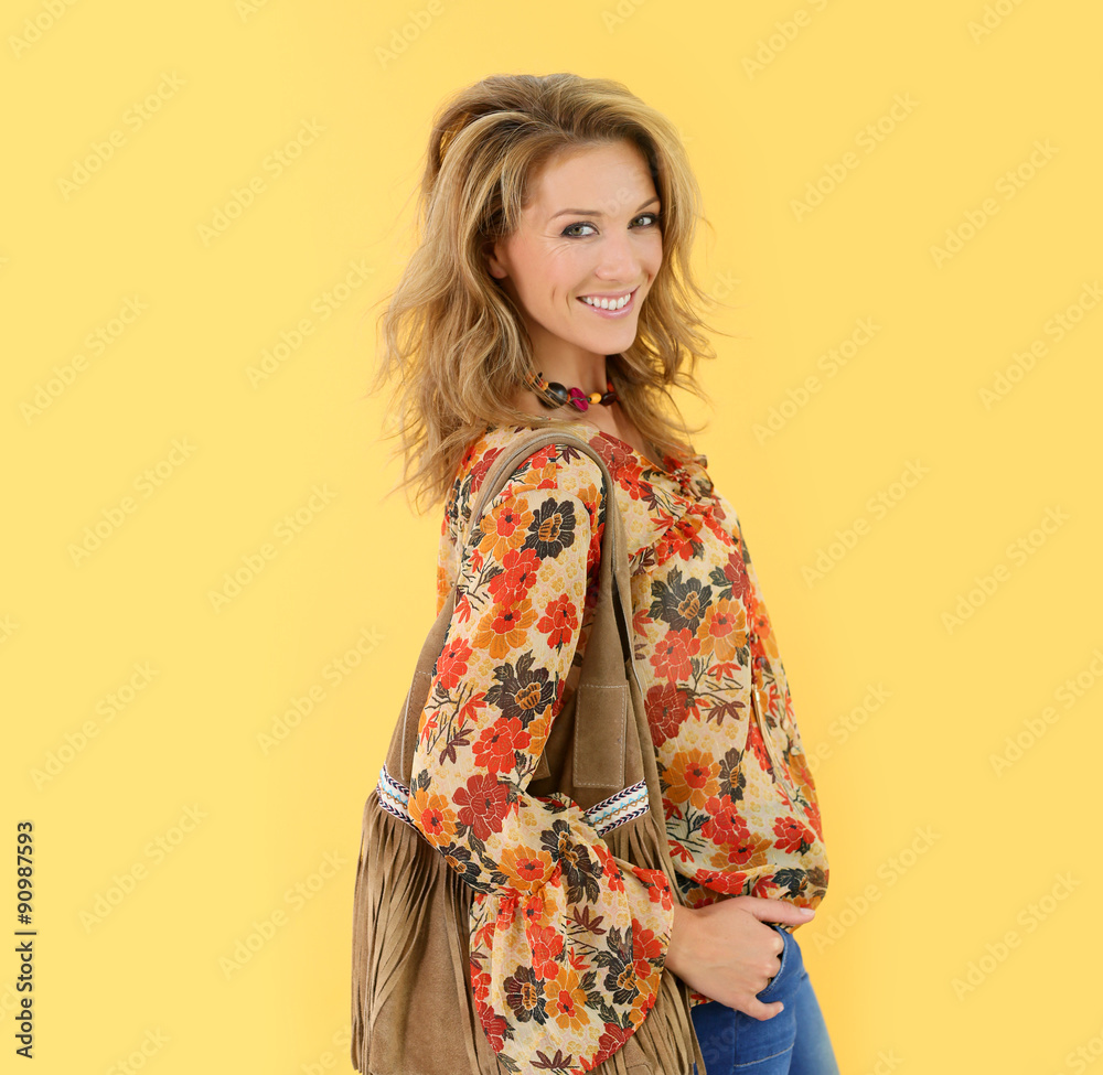 Beautiful trendy woman, isolated on yellow background Beautiful trendy woman, isolated on yellow background