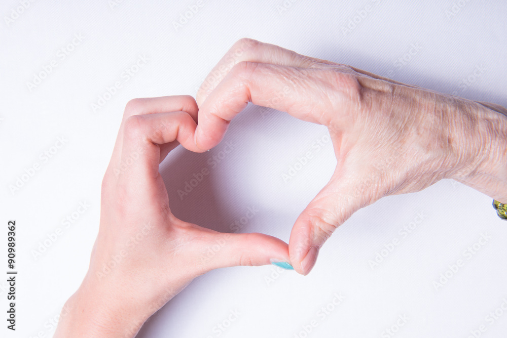 grandmother's and children's hands form heart grandmother's and children's hands form heart