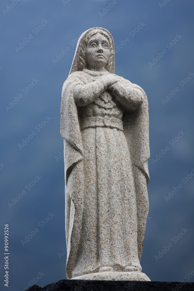 Statue of a praying lady Statue of a praying lady