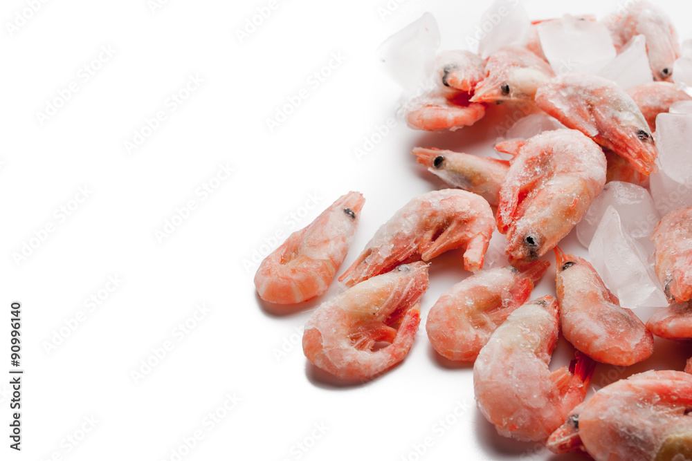 Frozen shrimps in the right side of the white background