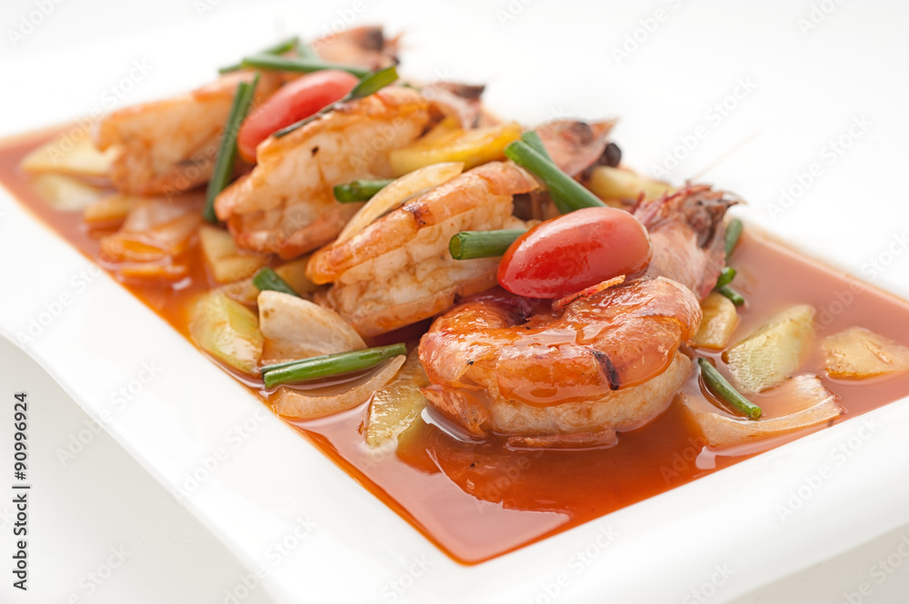 Fried shrimps with sweet and sour sauce isolated on white Fried shrimps with sweet and sour sauce isolated on white