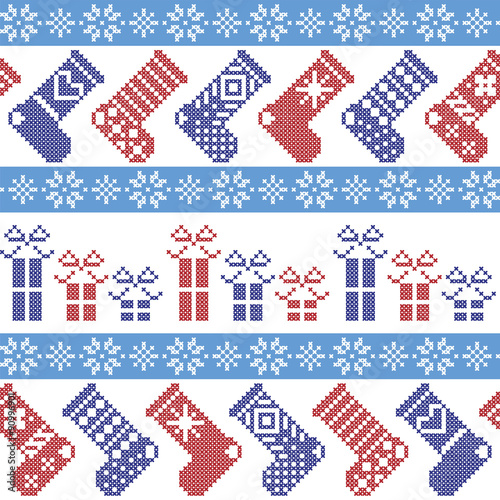 Dark blue, light blue and red Nordic Christmas pattern with stockings, stars, snowflakes, presents, decorative ornaments in scandinavian cross knitted cross stitch 
