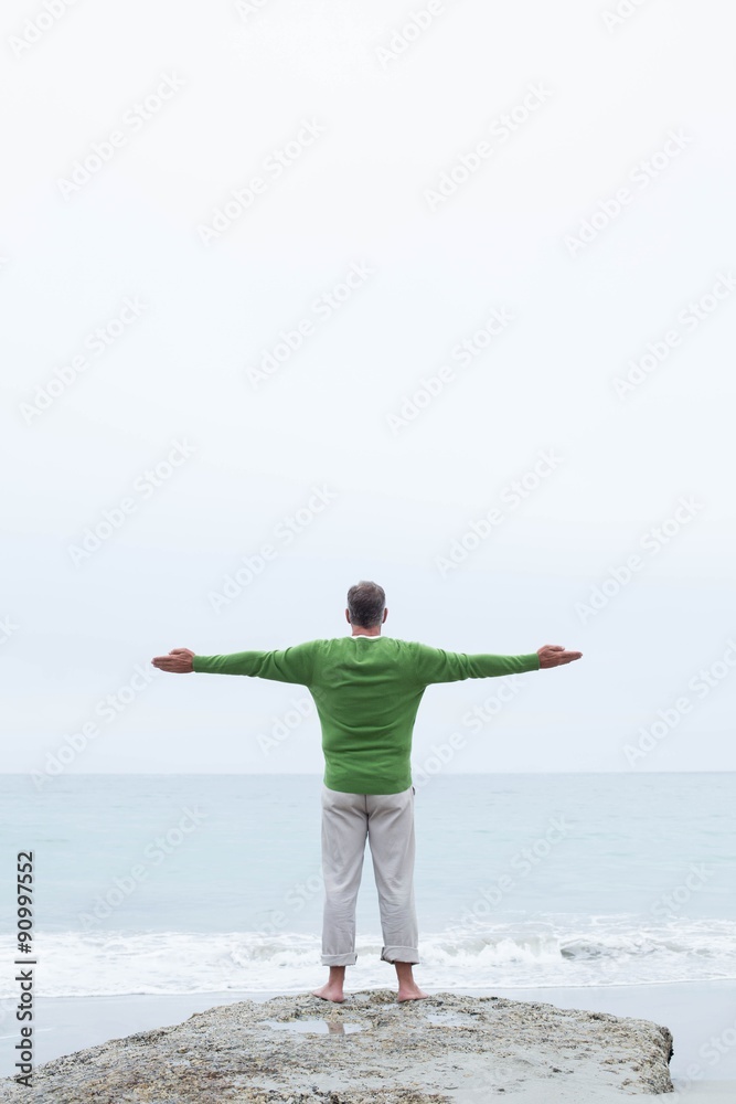 Man standing at the shoreline Man standing at the shoreline