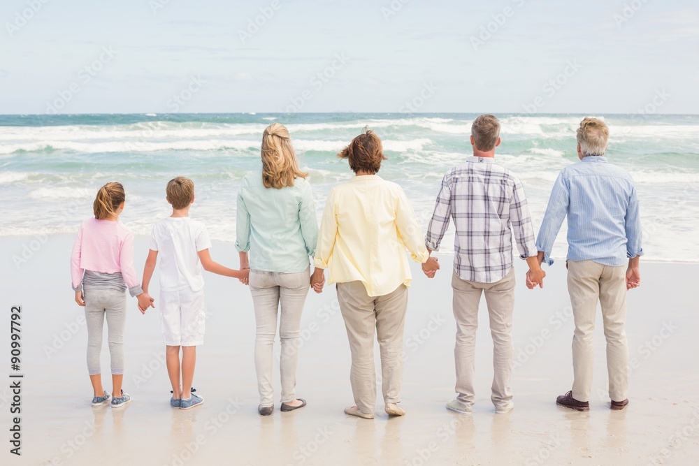 Multi generation family standing beside one another Multi generation family standing beside one another