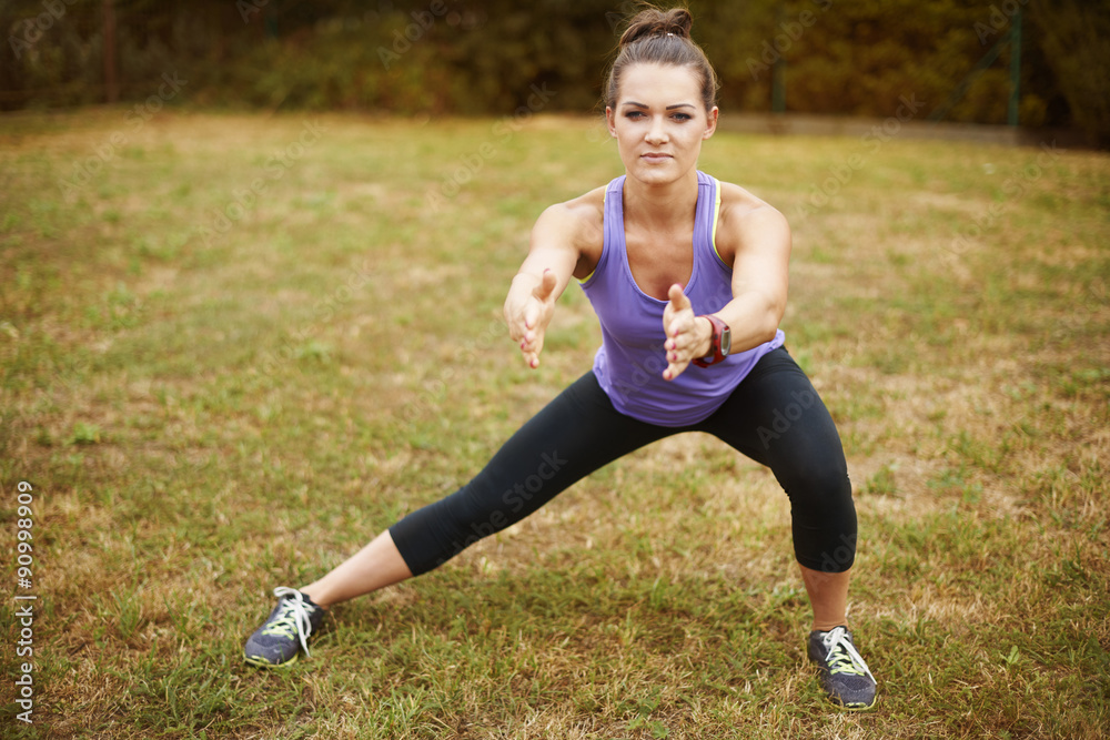 Woman doing some exercises in the park. Woman doing some exercises in the park.