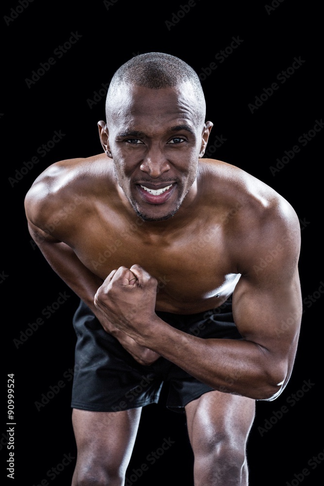 Fototapeta premium Portrait of muscular man flexing muscles