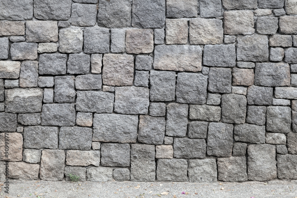 Gray stone wall and road, background texture