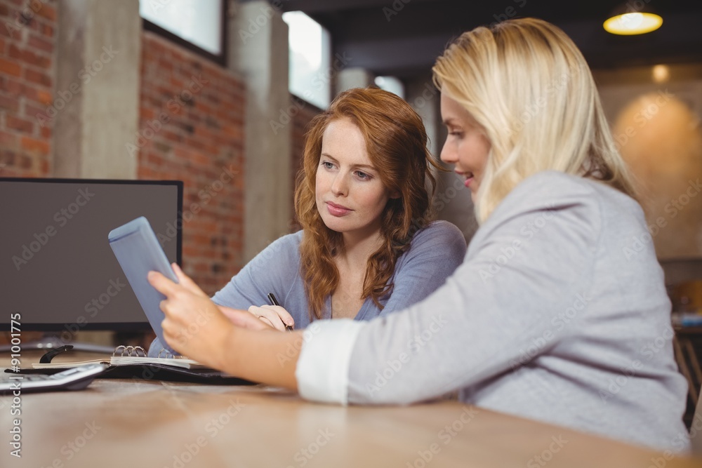 Beautiful businesswoman briefing colleague Beautiful businesswoman briefing colleague