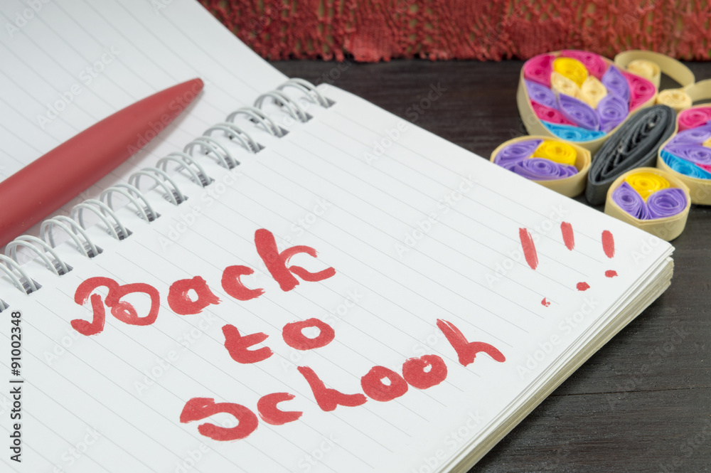 Back to school written on a notebook Back to school written on a notebook