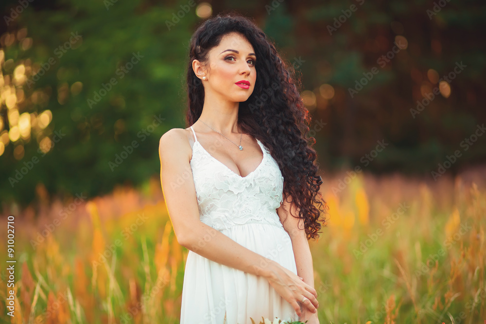 beautiful girl in the field, with long black hair