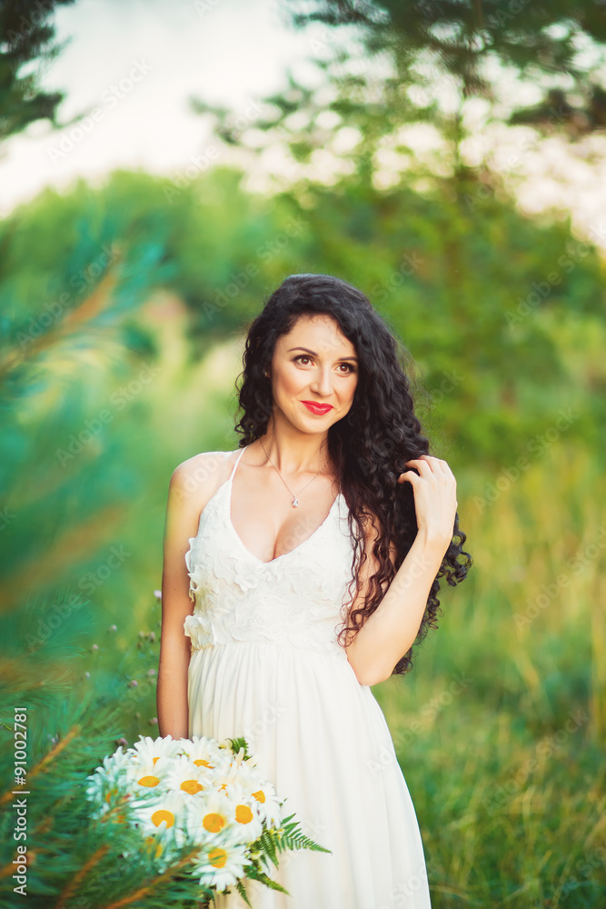 beautiful young girl in a field in white dress has beautiful lon beautiful young girl in a field in white dress has beautiful lon