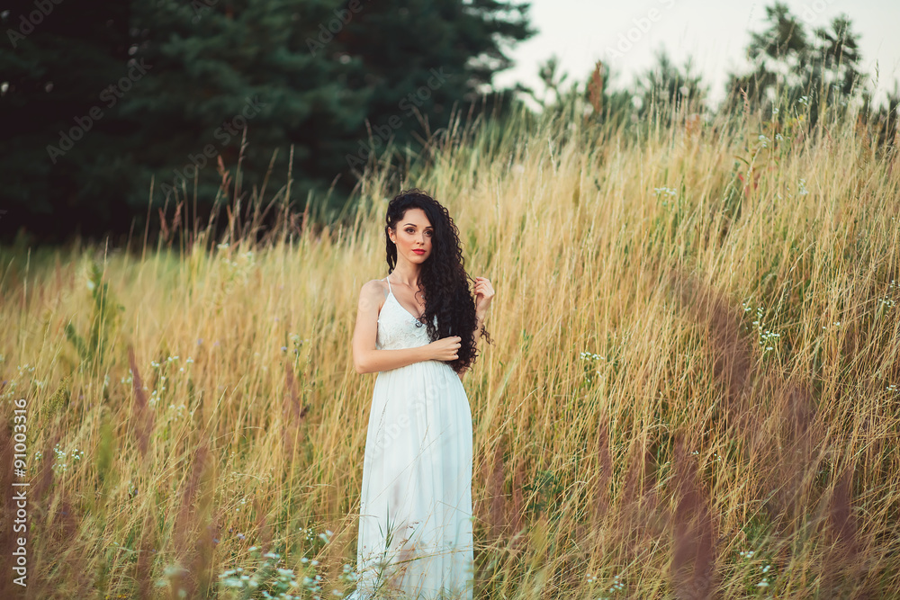 Obraz premium beautiful girl with black hair in field