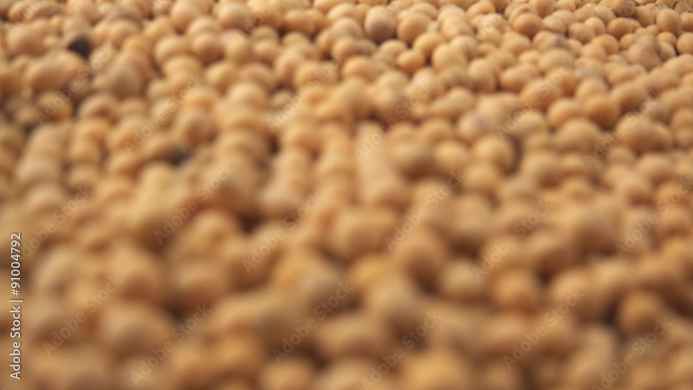 Soy beans pile, harvested crops of GM plants for food production, selective focus shifting with shallow depth of field, 4k uhd 2160p footage Soy beans pile, harvested crops of GM plants for food production, selective focus shifting with shallow depth of field, 4k uhd 2160p footage