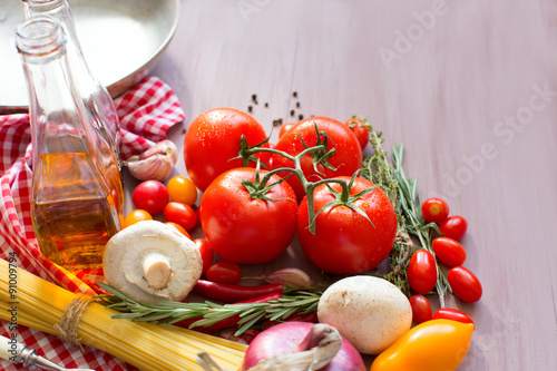 Background Italian food, pasta, tomatoes.