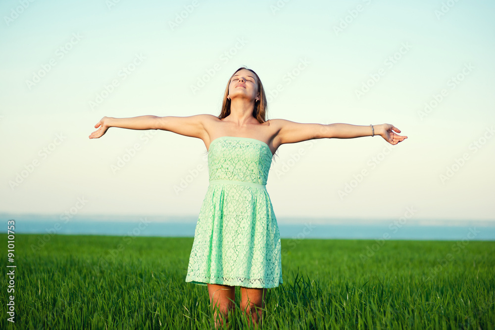 Happiness woman stay outdoor under sunlight of sunset Happiness woman stay outdoor under sunlight of sunset