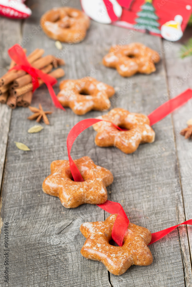 Honey cakes with spices on a wooden background. Christmas compos Honey cakes with spices on a wooden background. Christmas compos