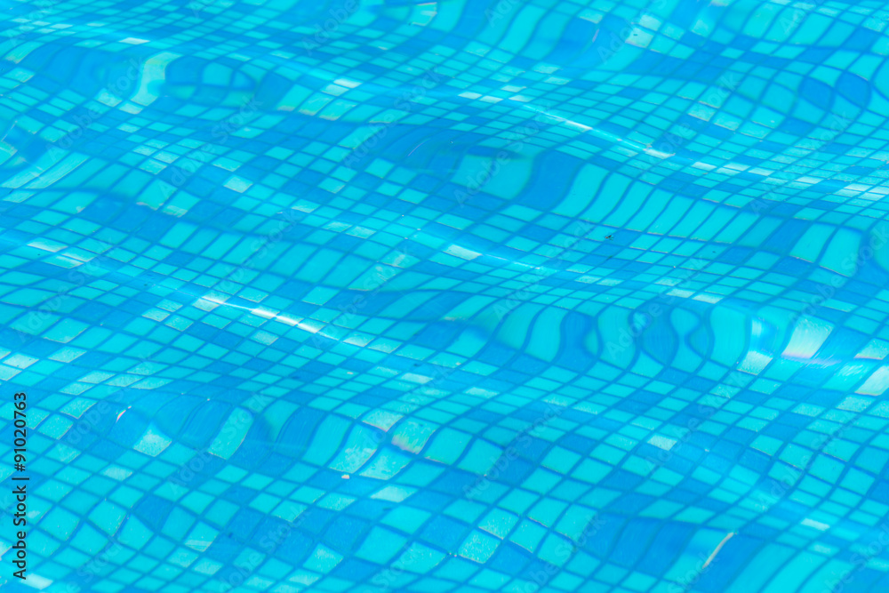 Texture of blue water in the pool Texture of blue water in the pool